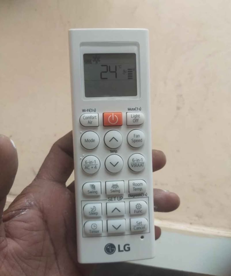 LG 1.5 Ton 3 Star AC remote control showing 24°C temperature setting with temp up and down buttons